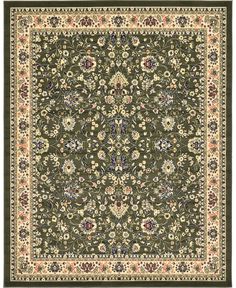 a green rug with an ornate design on the center and bottom, surrounded by flowers