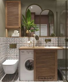 a washer and dryer in a bathroom with wood accents on the wall above it