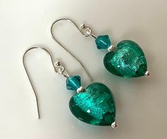 Christmas order/postage for US/Canada/NZ must be upgraded to express to arrive by Christmas. Australia regular post cut off date- Friday 15th Dec Stand-out teal coloured Murano glass beads with silver foil interior. These pretty heart earrings are made from genuine handmade Murano glass beads. They are Venetian-made beads that have a silver foil interior and gleam in the light. They are finished with matching Swarovski crystals and sterling silver ear hooks and silver tone findings. They would make a great gift for Valentine's day, birthdays and other special occasions! Weight: 2g each Earwire diameter: 0.9mm  They will come wrapped in tissue in a velvet bag. See all my creations at bdearrings.etsy.com Follow me on Instagram @bdearrings Christmas Australia, Murano Glass Earrings, Pretty Heart, Murano Glass Beads, Earrings Green, Venetian Glass, Green Earrings, Velvet Bag, Silver Foil