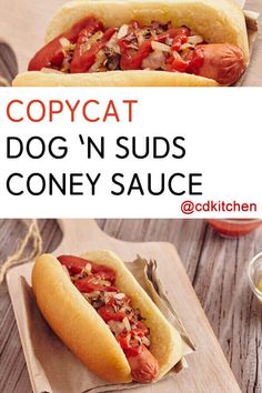 two hot dogs on buns with condiments and sauce