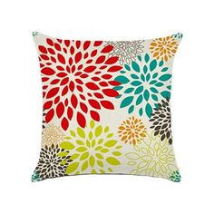 a colorful pillow with flowers on the front and back, sitting on a white background