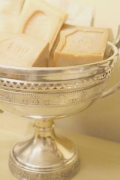 soap bars in a silver bowl on a table