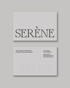 two business cards with black and white lettering on them, one has the word serene in