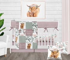 a baby crib bedding set with an image of a bison on the wall