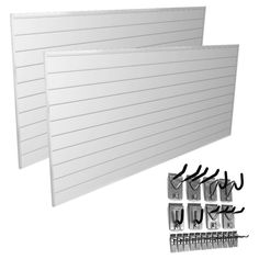 two white wall panels with hooks and clips