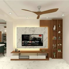 a modern living room with white marble walls and ceiling fan in the center, along with built - in shelving