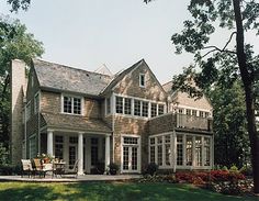 a large house with many windows and white trim