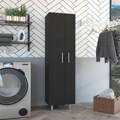 a washer and dryer in a room next to a shelf with clothes on it