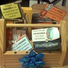 a wooden box filled with lots of books and magnets on top of a table