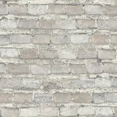 an old brick wall is shown in grey and white