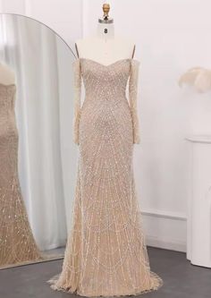 a mannequin is shown in front of a dress with sequins on it