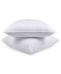 two white pillows stacked on top of each other