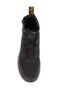 The label's Original boot gets reimagined for contemporary utility in a hybrid construction of lightweight Ajax leather and Extra Tough 50/50 fabric.The cemented Tarian lug sole is finished with DM's iconic yellow topstitching. 2" platform, 6" shaft (size 9) Lace-up style; side zip closure Textile and leather upper/leather lining/synthetic sole Imported Lug Sole, Up Styles, 50 50, Boots Men, Side Zip, Leather Upper, Nordstrom, Lace Up, Boots