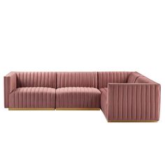 a pink velvet couch with wooden legs and armrests, on a white background