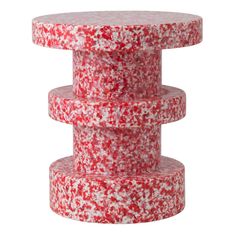 red and white sprinkles stacked on top of each other