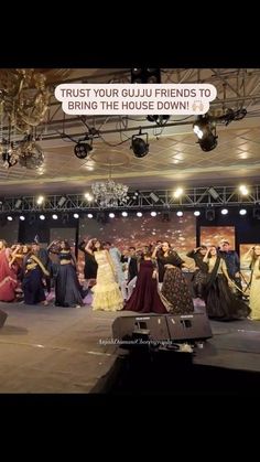 a group of people standing on top of a stage in front of a banner that says trust your guju friends to bring the house down