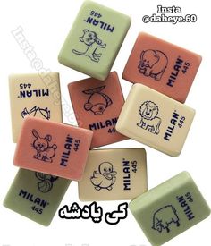 four different colored soaps with cartoon animals on them and the words written in arabic