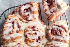 several pastries sitting on top of a wire rack