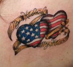 an american flag heart tattoo on the back of a woman's shoulder and chest