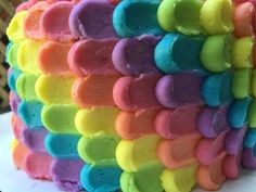 there is a cake that has been made to look like rainbows