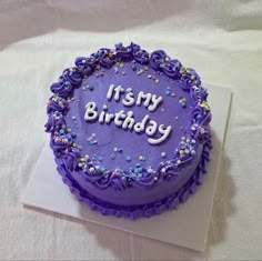 a purple birthday cake with the words it's my birthday written in frosting