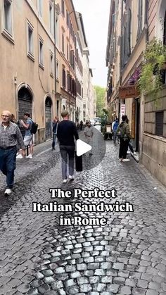 people walking down an alley way with the words, the perfect italian sandwich in rome