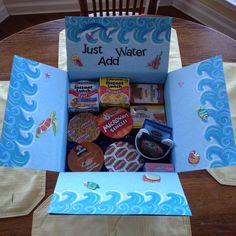 an open box with cookies inside sitting on a table