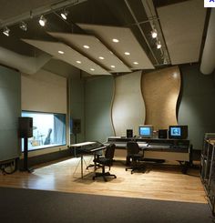 an empty recording studio with sound equipment