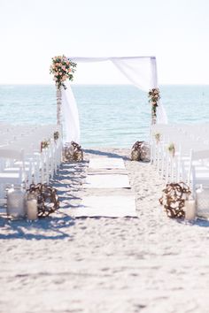 an outdoor wedding setup on the beach