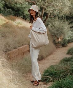 Linen Bucket Hat Natural Inspired by fisherman styles, our elevated take on the classic bucket hat is the summer’s definitive beach bag essential. 100% linen. Made in Portugal. | Jenni Kayne Women's Linen Bucket Hat Size Medium/Large Summer Outfits Bucket Hat, Linen Bucket Hat, Fisher Hat Outfit, Natural Linen Sun Hat For Beach, Natural Linen Sun Hat For The Beach, Natural Linen Sun Hat For Vacation, Chic Natural Sun Hat For Everyday Use, Chic Natural Sun Hat For Everyday, Chic Natural Color Sun Hat For Everyday Use