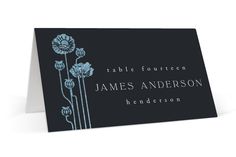 a black and white card with blue flowers on the front, reads table fourteen james anderson