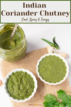 two bowls filled with green pesto next to some parsley and cilantro