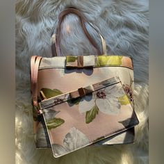 Ted Baker London Cherry Chatsworth Floral Satin Shopper Tote With Clutch Color: Nude Pink Dimensions: 12” L X 5” D X 11” H Handle Drop: 9” Pouch: 6.5” H X 10” L Details: 2 Interior Slip Pouches 1 Interior Zip Pouch Detachable Clutch Rose Gold Hardware Rose Gold Satin Metallic Accents With Floral Detailing Rose Gold Bow Detail Pink Lined Ted Baker Logo Interior With Bow Accents Clutch Is Nwot; Original Protective Film Still Attached To Clutch (Please See Photos Of Rose Gold Zipper And Bow) Please Ted Baker London Bags, Baker Logo, Rose Gold Satin, Gold Satin, Rose Gold Hardware, Ted Baker London, Shopper Tote, Nude Pink, Zip Pouch