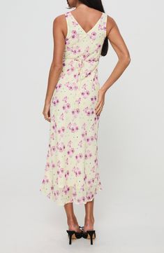 A dreamy floral print covers this slinky dress cut in a sleeveless silhouette and cinched at the waist by a back tie accent. 51" length Hidden side-zip closure V-neck Sleeveless Attached waist tie Lined 100% polyester Machine wash, tumble dry Imported Sleeveless Fitted Floral Dress With Tie Back, Fitted Sleeveless Floral Dress With Tie Back, Sleeveless Ruched Back Maxi Dress For Brunch, Sleeveless Maxi Dress With Ruched Back For Brunch, Chic Sleeveless Floral Dress With Tie Back, Sleeveless Rayon Dress With Tie Back, Flowy Spaghetti Strap Sleeveless Dress With Floral Print, Floral Sleeveless Tie Back Dress For Brunch, Flowy Sleeveless Dress With Spaghetti Straps And Floral Print