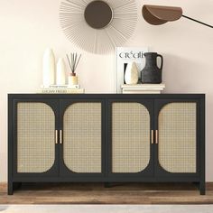 a black and gold sideboard with wicker doors in a modern living room setting