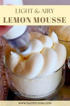 the ingredients for lemon mousse are being mixed together in a glass bowl with a spoon