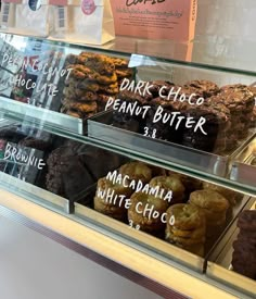 a display case filled with lots of different types of cookies