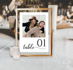 a table number sign with a photo on it