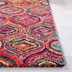 a multicolored area rug on the floor