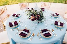 a table set with place settings and napkins