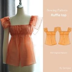 an orange top with ruffles on the shoulders is shown in front of a mannequin