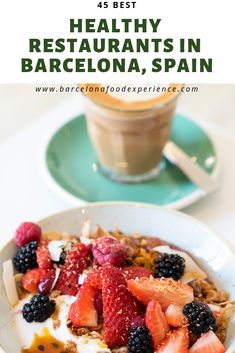 a bowl of granola with berries and yogurt in the middle, next to a cup of coffee