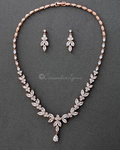 a necklace and earring set with crystal stones