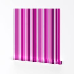 a pink and white striped wallpaper with vertical lines on the bottom half of it