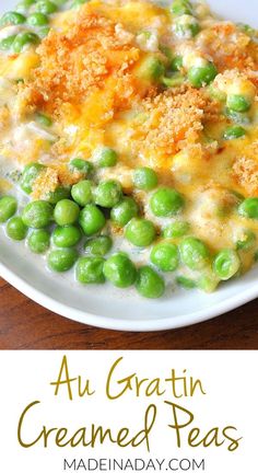 a white plate topped with peas covered in cheese