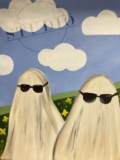 two white ghostes wearing sunglasses are standing in front of a blue sky with clouds