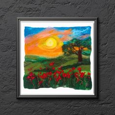 a painting hanging on the wall next to a black frame with red flowers in it