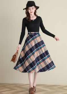 "★★ FEATURES * Wool skirt * Polyester lining * Two side seam pockets * Right zipper closure * back elastic band * Plus size full skirt * A Line Skirt * Perfect for Winter, autumn * Dry clean ★★ The model is 170 cm (5′ 7″) tall with a 80 cm (31.5\") bust, 66 cm (26\") waist. She is wearing the wool plaid skirt in size XS. ★★ Please select custom order according to the follow situation Your height is not between 155 cm- 172 cm Your weight is over 75 kg Request the length ★★ Get your size in Size C Retro A-line Winter Skirt, Beige Flared Skirt For Winter, Winter Beige Flared Skirt, Retro Winter Skirt, Vintage A-line Skirt For Fall, Retro Full Skirt Bottoms For Winter, Vintage Flared Skirt For Winter, Vintage Flared Winter Skirt, Vintage Long Skirt For Winter