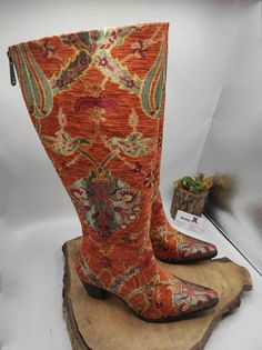 This is handmade genuine leather custom made ethnic pattern cowboy style boots. Made with naturel leather, chenille tapestry, ykk zipper. There is every size available. Knee high boots. Cowboy style. **İf you need wider calf please let us know your calf circle measurments. To make custom boots NO extra charging. There is heel 2 inches 5 cm. Pointy toe. Light and very comfy. İf you like to get lower heel round toe please note it.) Waterproof. There is ethnic and tulip pattern on terracotta color. Boots Low Heel, Custom Cowboy Boots, Festival Boots, Fashion Cowboy Boots, Soft Boots, Purple Boots, Everyday Boots, Tulip Pattern