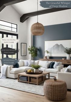 a living room with blue walls and white furniture